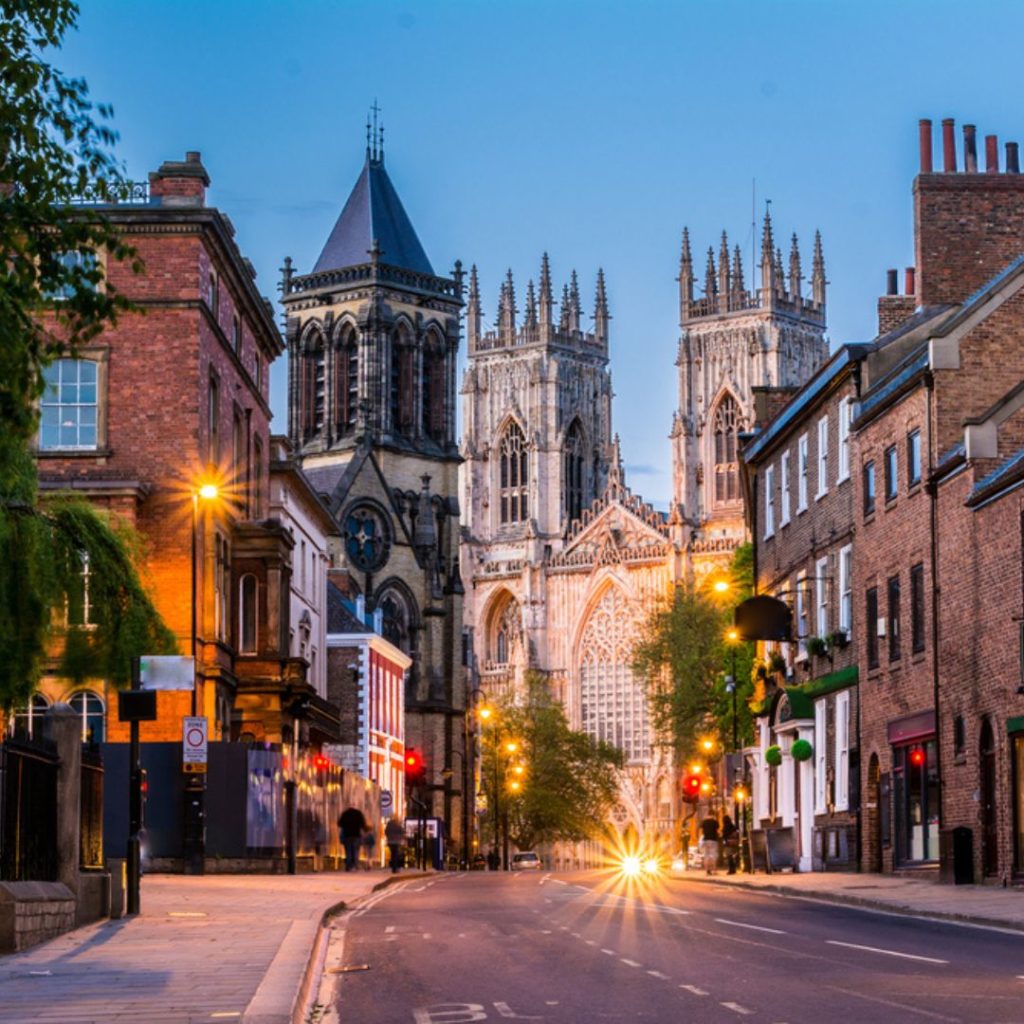 A street in York at night with the minster in the background