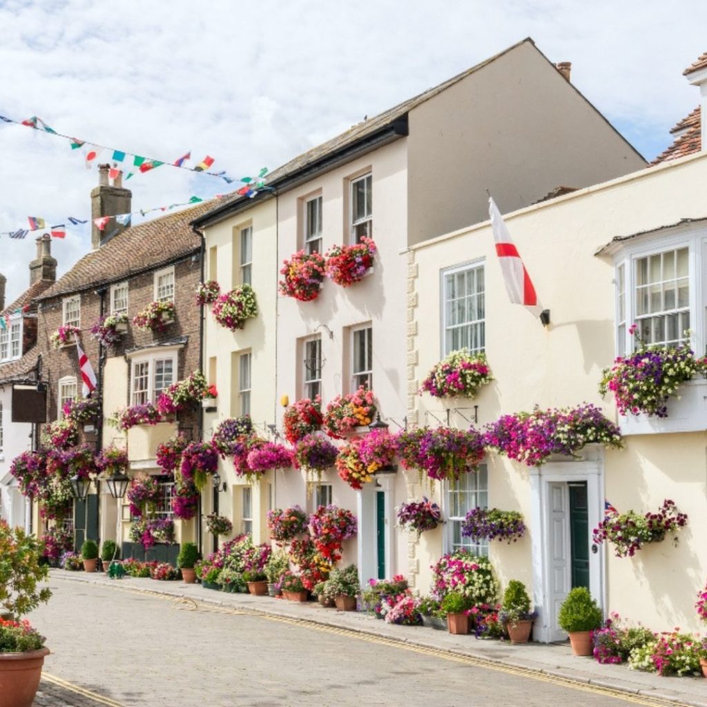 Whiety buildings covered in flowers