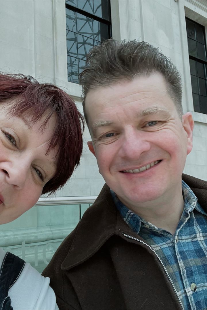 Man and a Women close up smiling at the camera