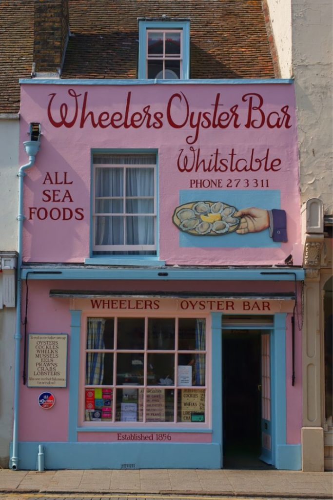 The pink shop front of Wheelers Oyster Bar